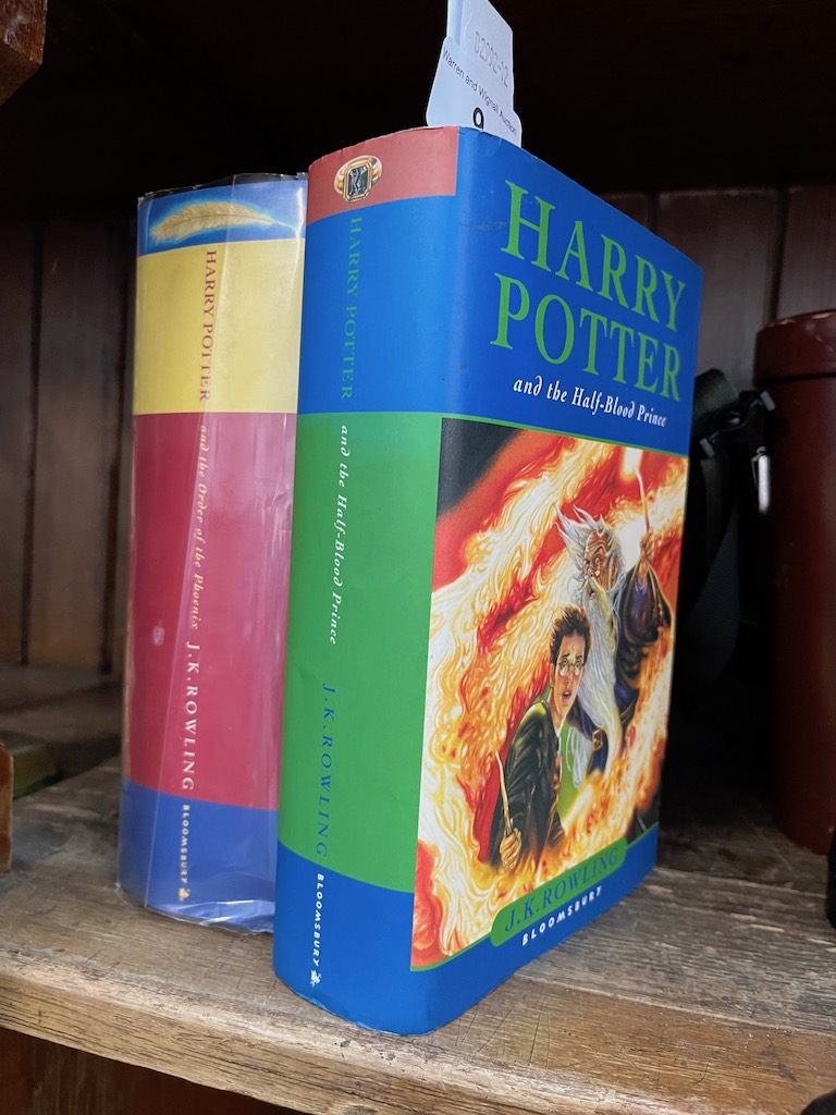 Two Harry Potter first editions; Harry Potter and the Half Blood Prince (with error on page 99)