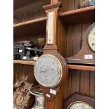 A domed Napoleon style mantle clock with pendulum and key.