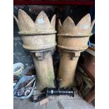 Two chimney pots with crowns.