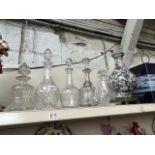 Five glass decanters and a repro vase