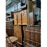 Various items of furniture; a panelled oak wardrobe, oak dressing table, oak chest of drawers,