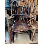 An early 19th century elm Windsor chair.