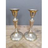 A pair of George V silver candlesticks, Walker & Hall, Sheffield 1913, height 16cm.