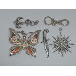 A group of five Thomas Sabo silver pendants to include anchor, bowie knife, cuffs, sunburst star and