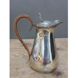 An Edward VII silver lidded jug with rattan bound handle, George Unite, Birmingham 1904, height