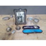 A mixed lot of hallmarked silver comprising a photo frame, four topped glass jars, a cased spoon,