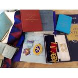 A box of Masonic regalia and books including one silver gilt jewel.