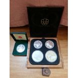 Canada Olympics silver coin proof set and a 2004 silver proof Canada dollar.