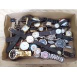 A box of assorted vintage and modern wristwatches.