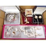 A mixed lot of costume jewellery including hallmarked silver, white metal, Swarovksi etc.