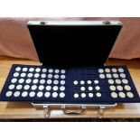 A coin collecting case containing assorted modern collectable coins to include 50ps, £2 & £1.