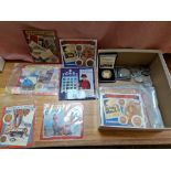 A box of assorted coins to include commemorative crowns, a Royal Mint coin "The opening of the