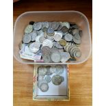 A tub of assorted GB & world coins and banknotes to include some silver.