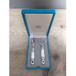 Georg Jensen, a cased pair of silver handled stainless steel bottle openers.