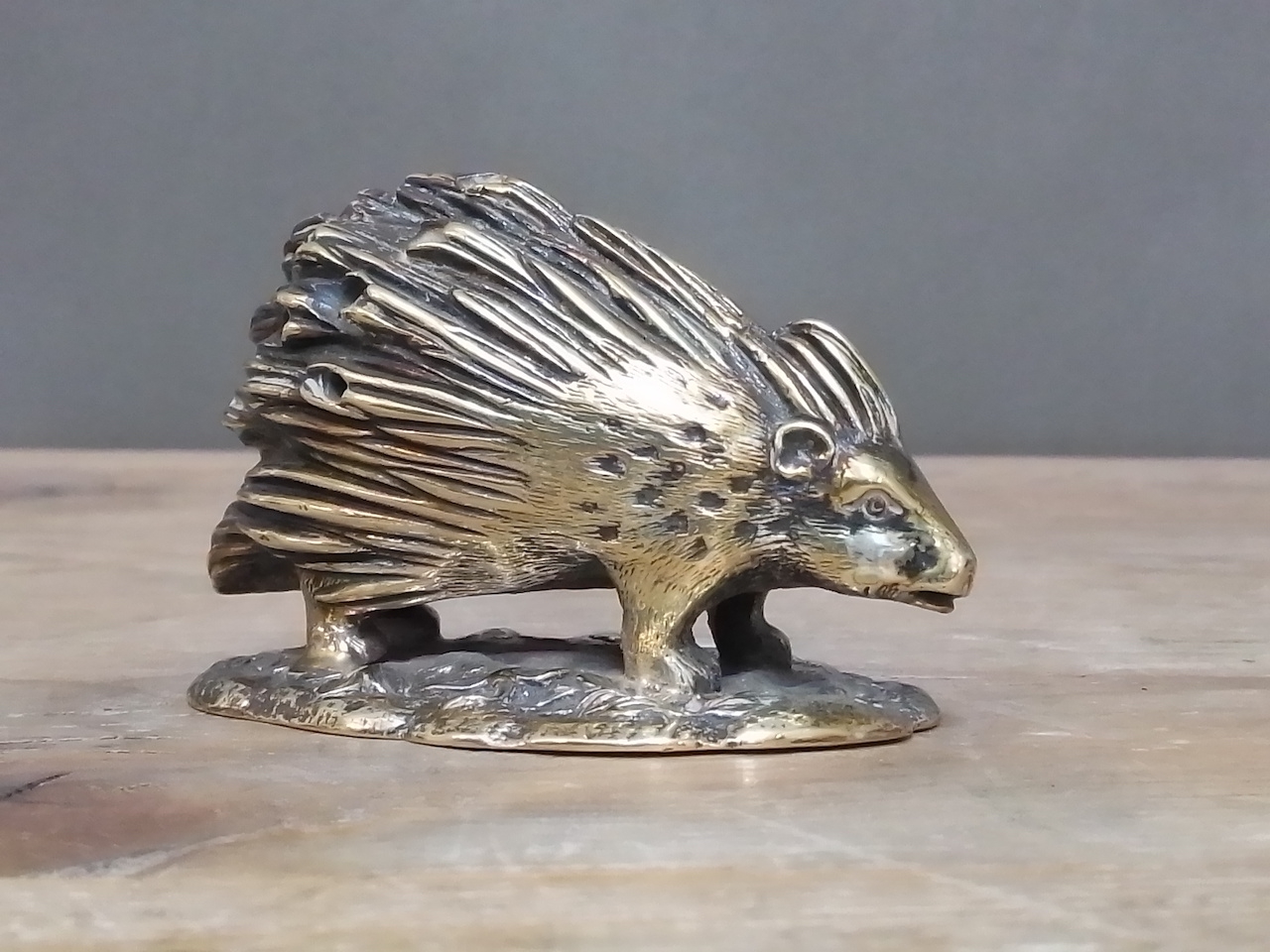 A Victorian novelty silver plated toothpick holder modelled as a porcupine and stood on a naturalist