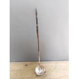 A 19th century twist baleen and white metal punch ladle, length 38cm. Condition - metal in our