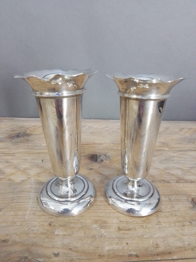 A pair of hallmarked silver vases, height 14cm.