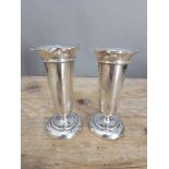 A pair of hallmarked silver vases, height 14cm.