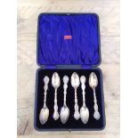 A cased set of imported silver spoons.
