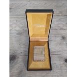 A vintage Dupont gold plated textured lighter with box.