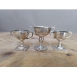 Three hallmarked silver trophies, tallest 7.5cm, wt. 4ozt.