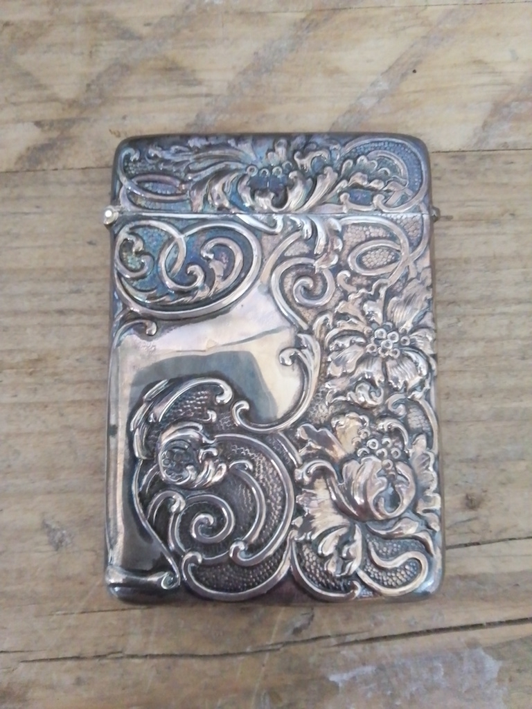 An Edward VII Art Nouveau style repousse silver card case, Reynolds & Westwood, Birmingham 1905, 6.