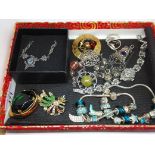 A tray of assorted white metal and vintage costume jewellery.