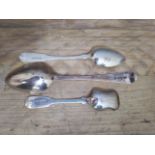 A group of three silver spoons comprising a George III desert spoon by Stephen Adams II London 1782,