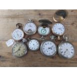 A group of eight assorted pocket watches.