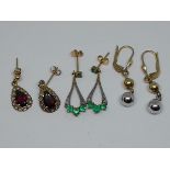 Three pairs of earrings comprising garnet set, emerald and diamond and spherical drop, various 9ct