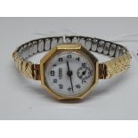 A ladies 9ct gold Hirco watch with gold plated flexi strap.