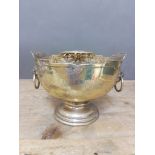 A George V silver punch bowl, shaped and pierced rim, twin mask and ring handles, presentation