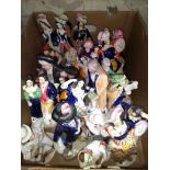 A box of Staffordshire pottery figures.