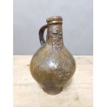 A 17th century Bartmann jug, height 20.5cm. Condition - various restoration.