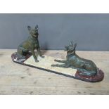 An Art Deco cast spelter figure of two dogs on marble base, length 66cm.