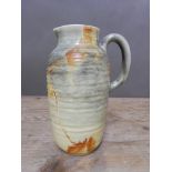 A Clarice Cliff Greek shaped jug, height 23.5cm. Condition - losses to foot rim, not sure if these