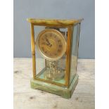 A late 19th century green onyx torsion clock, signed Boddington & Co, Manchester, height 26.5cm.