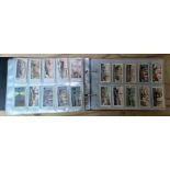 A folder of cigarette cards, full sets and some loose.