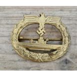 A German WWII Kriegsmarine U-boat War badge. Loss of gilt in places, missing hook. We believe this