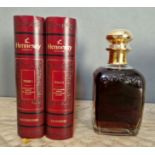 A bottle of Hennessy Cognac, Decanter, 40% vol, 70cl, in a book style red presentation case.