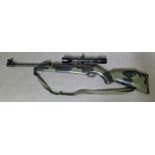 A Webley Tracker camoflage edition .22 calibre air rifle with a 4 x 32 telescopic sight, serial no.