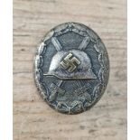 A German WWII Verwundetenabzeichen wound badge, in silver and brass, solid back. In good