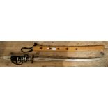 A reproduction katana sword in wooden scabbard.