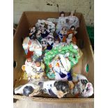 A box of Staffordshire pottery figures.
