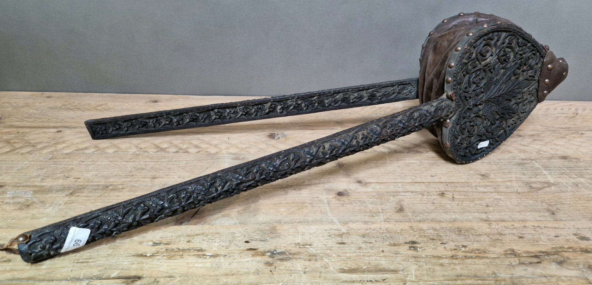 A 19th century Anglo Indian carved ebonised wood and studded leather bellows.