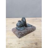 A 19th carved hard stone door stop modelled as a mythical dolphin on platform base, length 16.5cm.