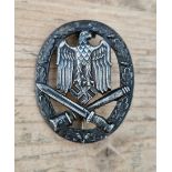 A German WWII Army (Heer) / Waffen-SS General Assault Combat badge. Good quality and detail, flat