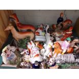 A box of assorted Staffordshire pottery horses and dog figures.