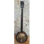 A vintage B.B. Mandard Quality four string banjo.