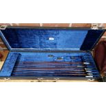 A case containing eight violin bows, various conditions, all missing hairs.
